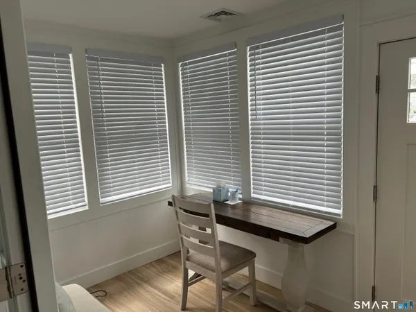 a view of an empty room with a window