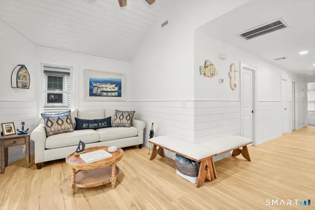 a living room with furniture and a table