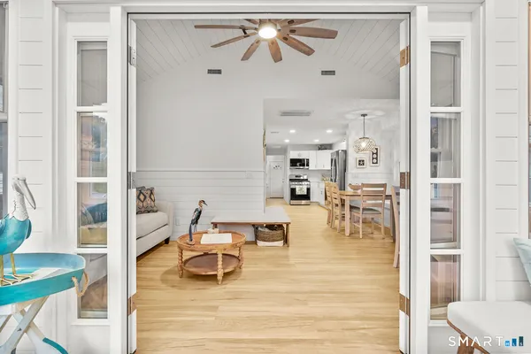 a view of a dining room with furniture and windows