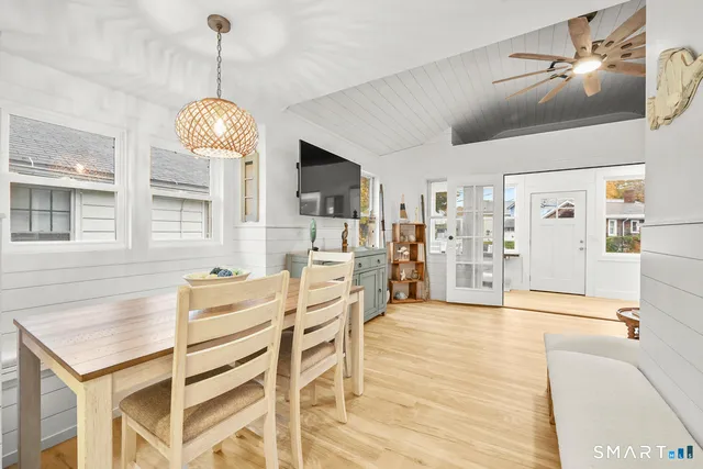 a view of a kitchen with furniture and chandelier