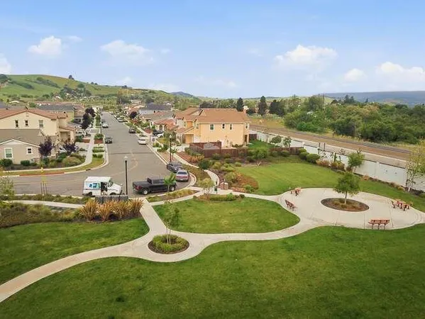 a view of a garden with houses