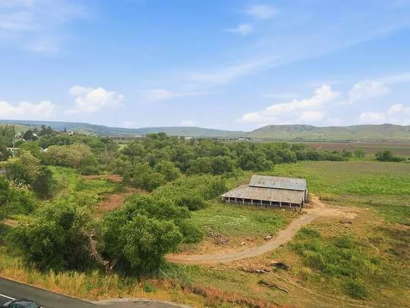 a view of a lake with houses in the back