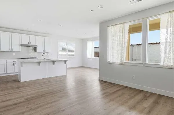 a view of kitchen with wooden floor and electronic window