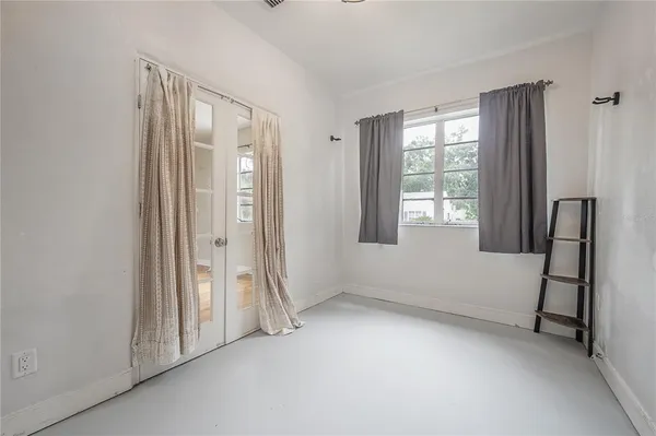 an empty room with windows