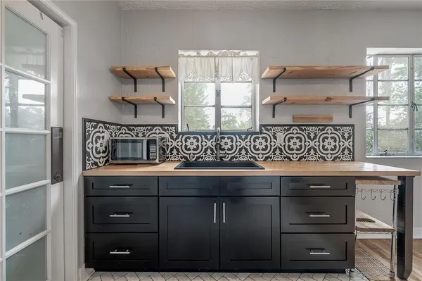 a kitchen with a sink and cabinets
