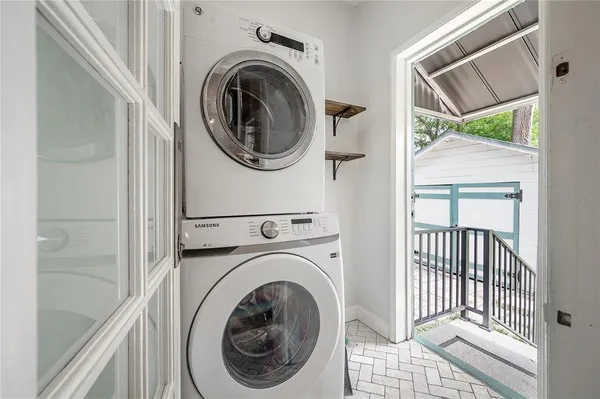 a view of a hallway with washer and dryer