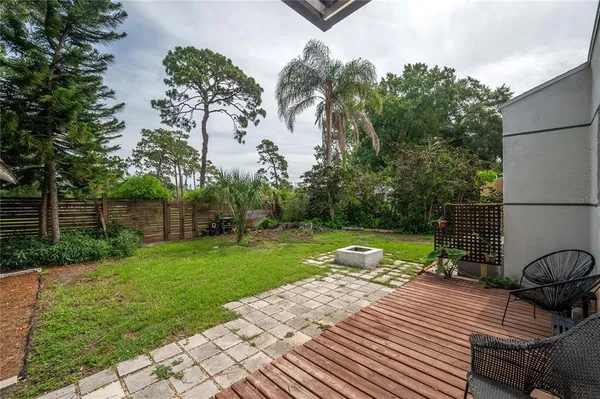 a view of a backyard with sitting area
