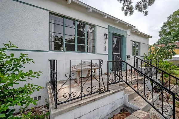 a view of a building with a potted plant