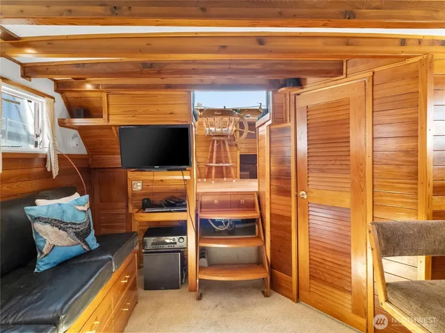a kitchen with granite countertop wooden cabinets and stainless steel appliances