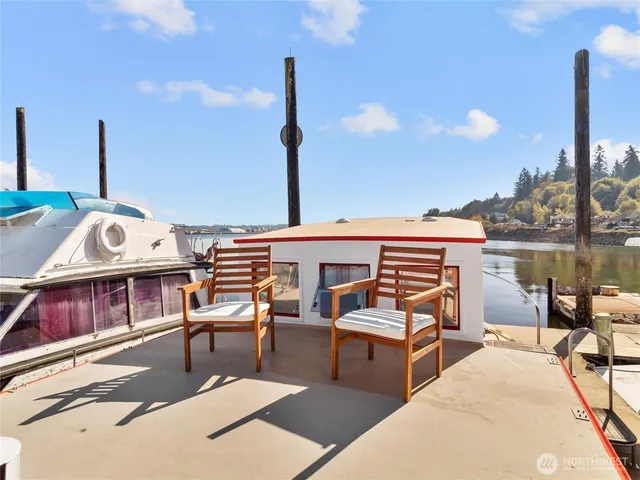 a view of swimming pool with outdoor seating