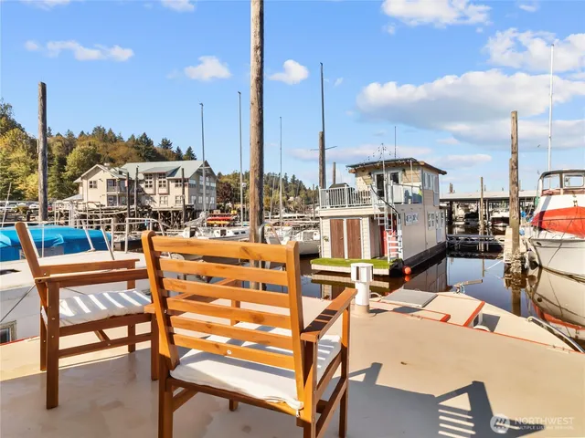 a view of a water with dining table and chairs