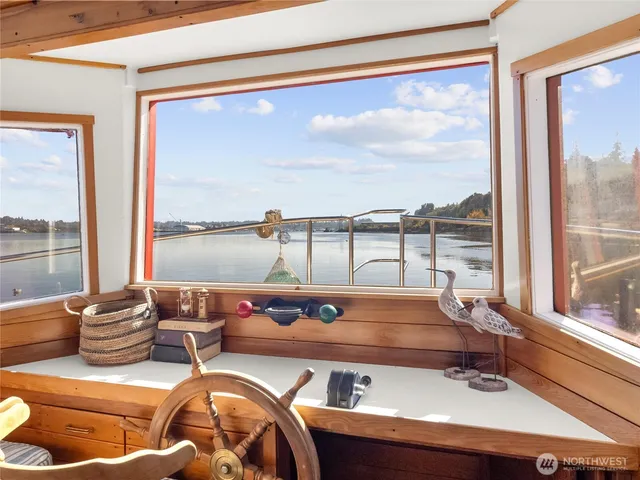 a view of a room with wooden floor and furniture