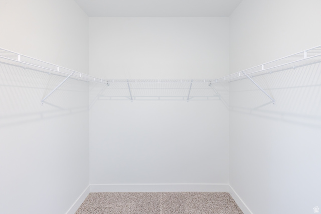 4662 Poplar Way, Unit Q302 Mapleton, UT 84664 - Photo 4 of 17 Walk in closet featuring light colored carpet