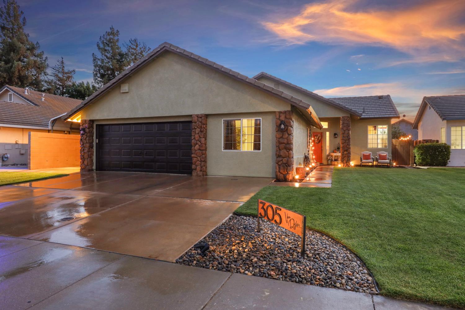 305 Van Dyken Way Ripon, CA 95366 - Photo 1 of 1 a front view of a house with a yard and garage