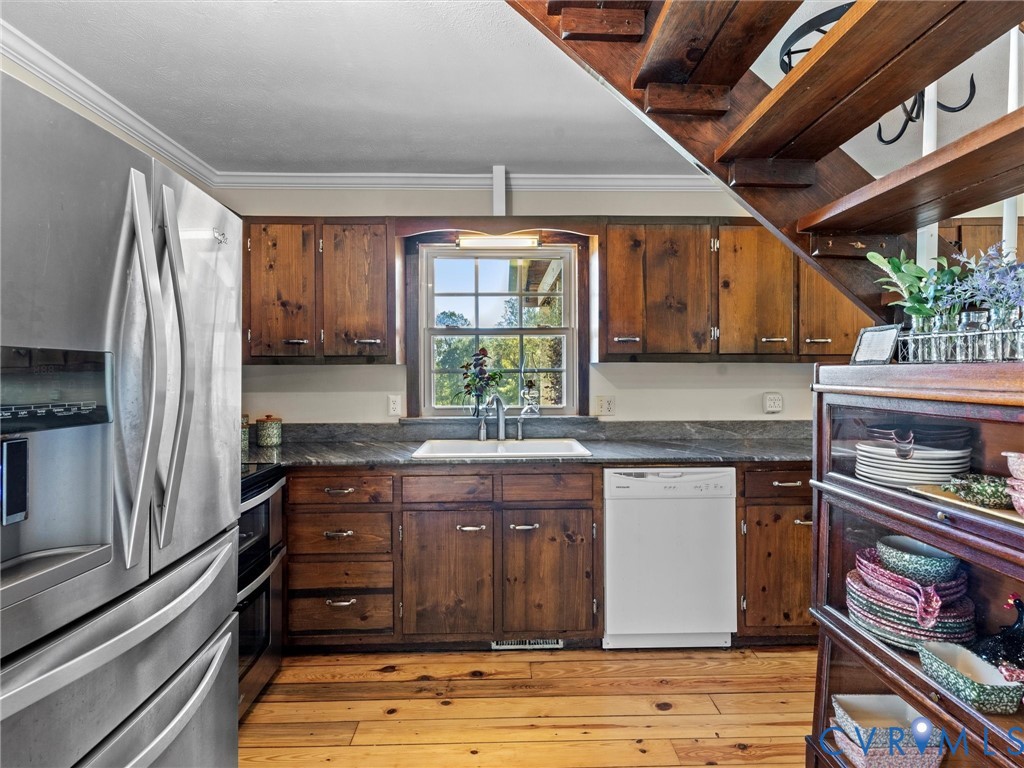 1024 Back Mountain Road Dillwyn, VA 23936 - Photo 15 of 50 a kitchen with stainless steel appliances granite countertop a stove sink and cabinets