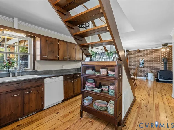 a view of a kitchen with furniture and staircase