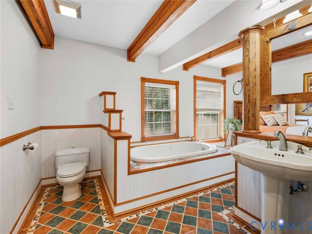 1024 Back Mountain Road Dillwyn, VA 23936 - Photo 30 of 50 a spacious bathroom with a sink a toilet and a bathtub
