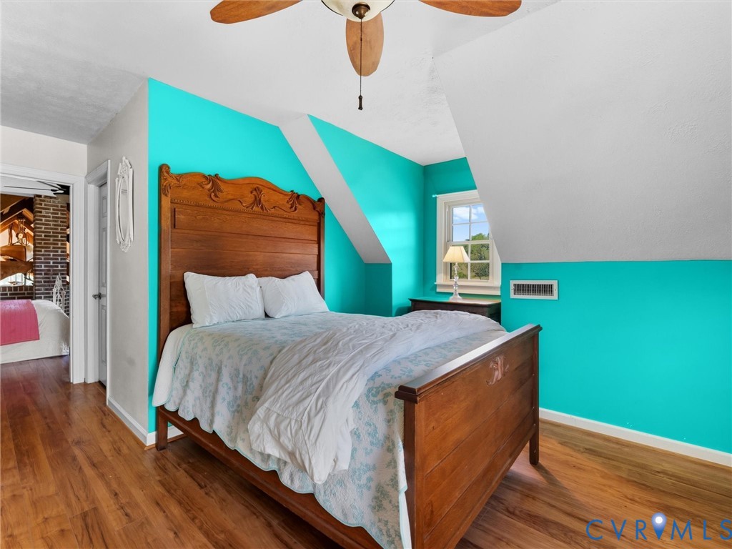 1024 Back Mountain Road Dillwyn, VA 23936 - Photo 37 of 50 a bedroom with a bed and wooden floor