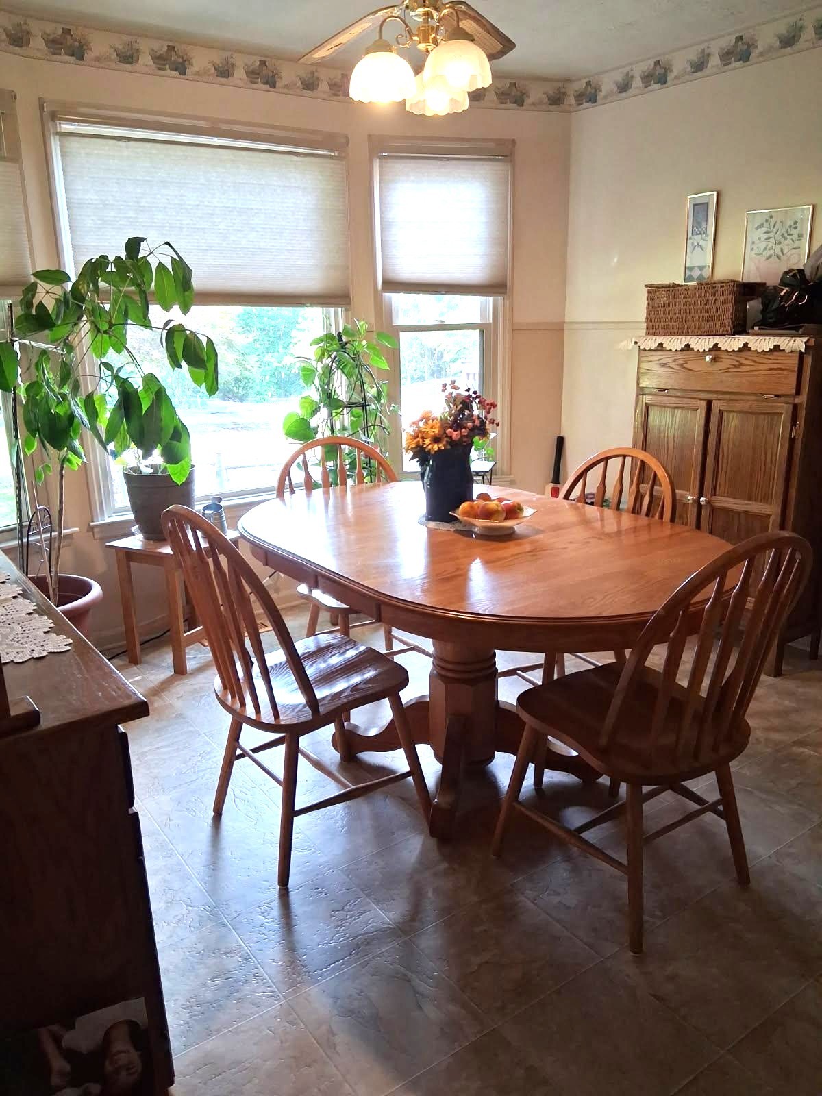 3168 Maxey Road Cedar Hill, TN 37032 - Photo 29 of 40 a dining room with furniture potted plants and wooden floor