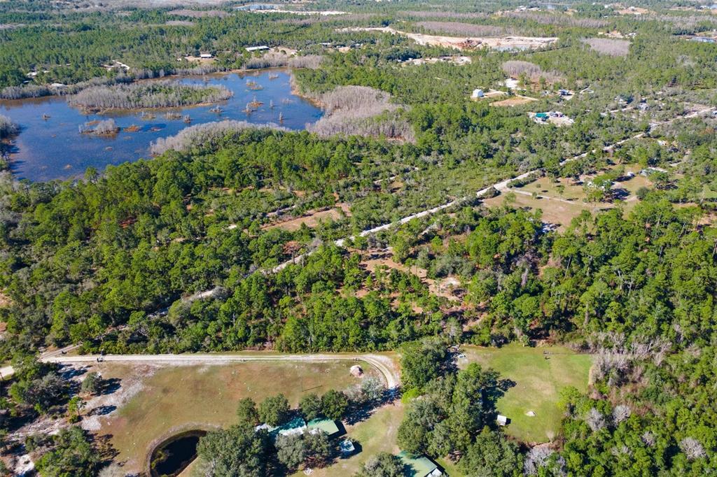 310 Fawn Trail Osteen, FL 32764 - Photo 6 of 6 a view of a lake with a city