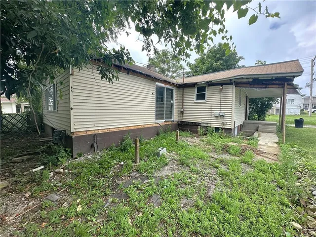 a backyard of a house with lots of green space