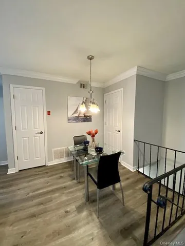 a workspace room with furniture and wooden floor