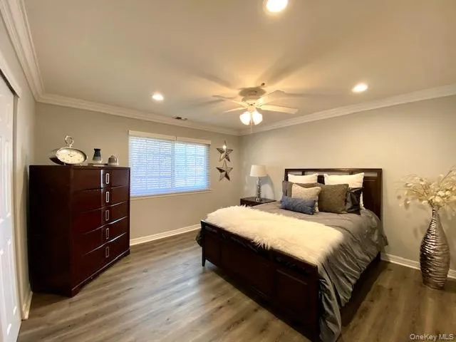 a bedroom with a bed and dresser