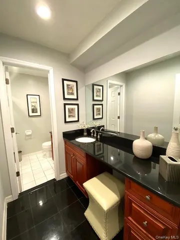 a kitchen with a sink and living room