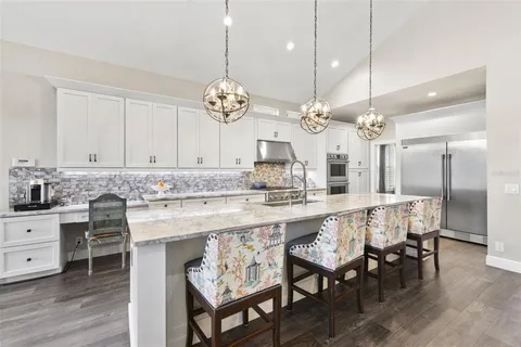 a kitchen with a table and chairs in it
