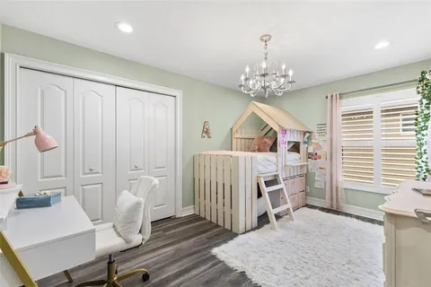 a bedroom with furniture and a window