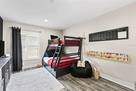 a bathroom with a granite countertop sink mirror vanity and toilet