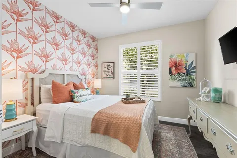 a bathroom with a granite countertop sink a toilet and a mirror