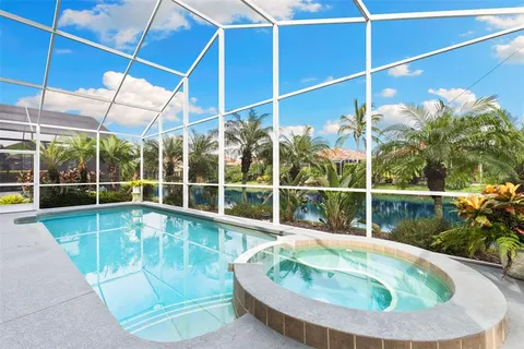 a view of swimming pool with outdoor seating