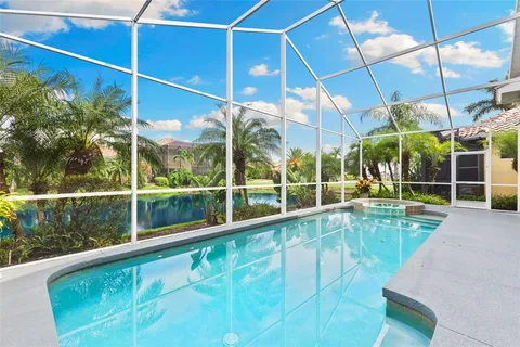 a view of an outdoor dining space with furniture and wooden floor