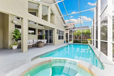 an aerial view of residential houses with outdoor space and river