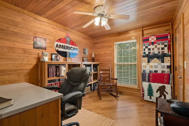 a work room with furniture and musical instruments