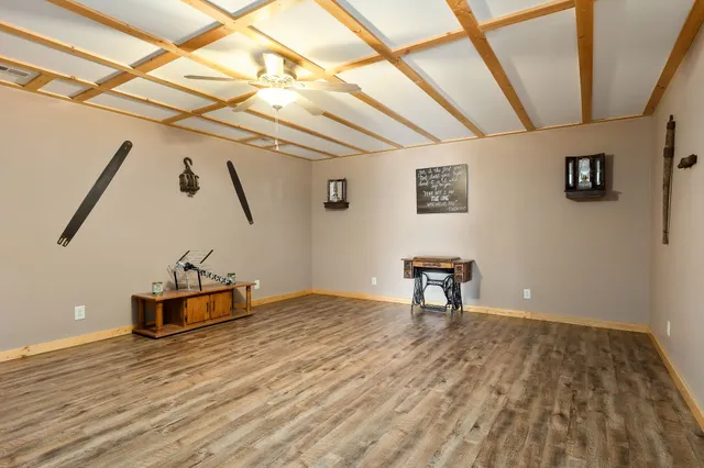 a view of a room with wooden floor
