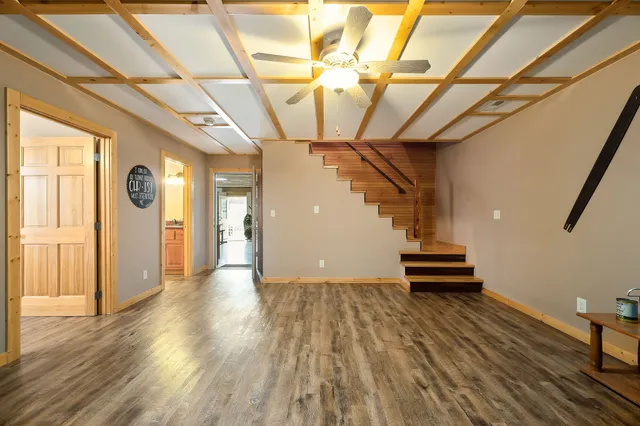 a view of entryway and hall with wooden floor