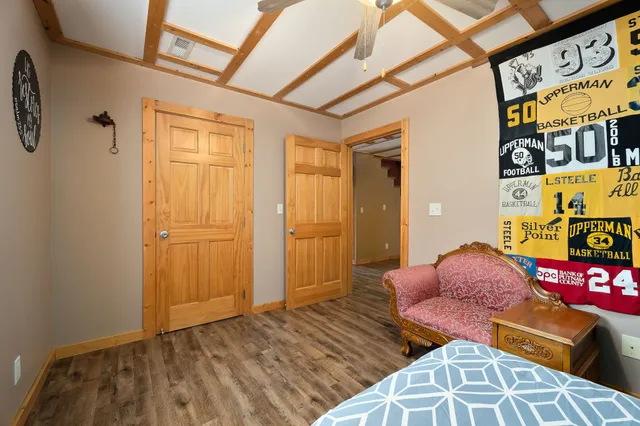 a bedroom with furniture and a window