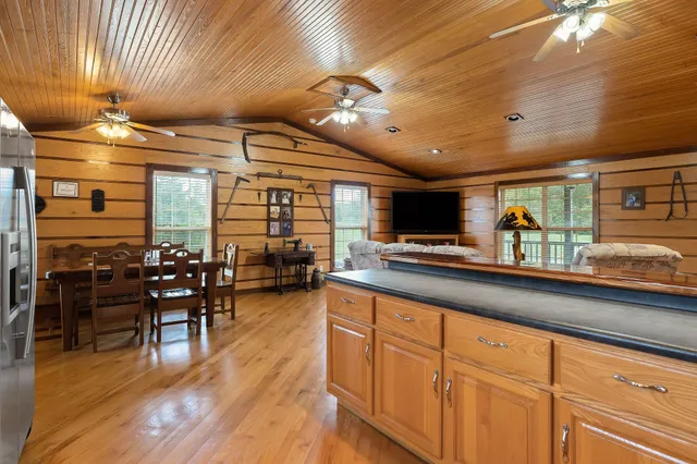 a kitchen with lots of counter top space and dining table