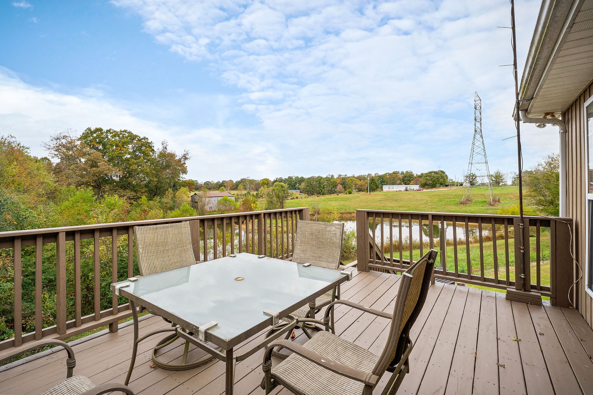 1195 Highland Avenue Baxter, TN 38544 - Photo 33 of 33 a view of a balcony with wooden floor next to a lake