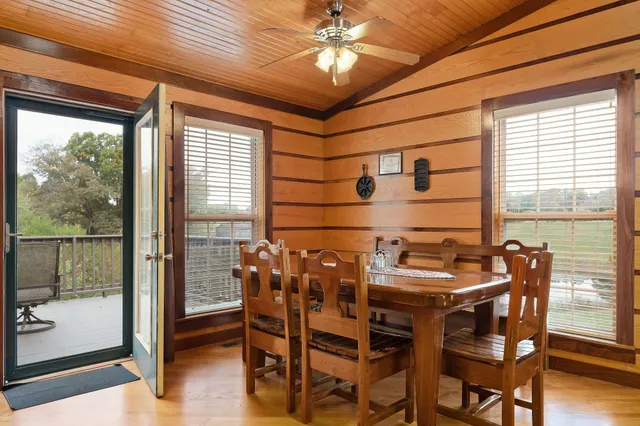 a dining room with furniture and window