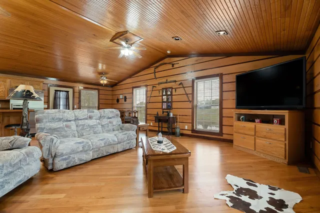 a living room with furniture and a flat screen tv
