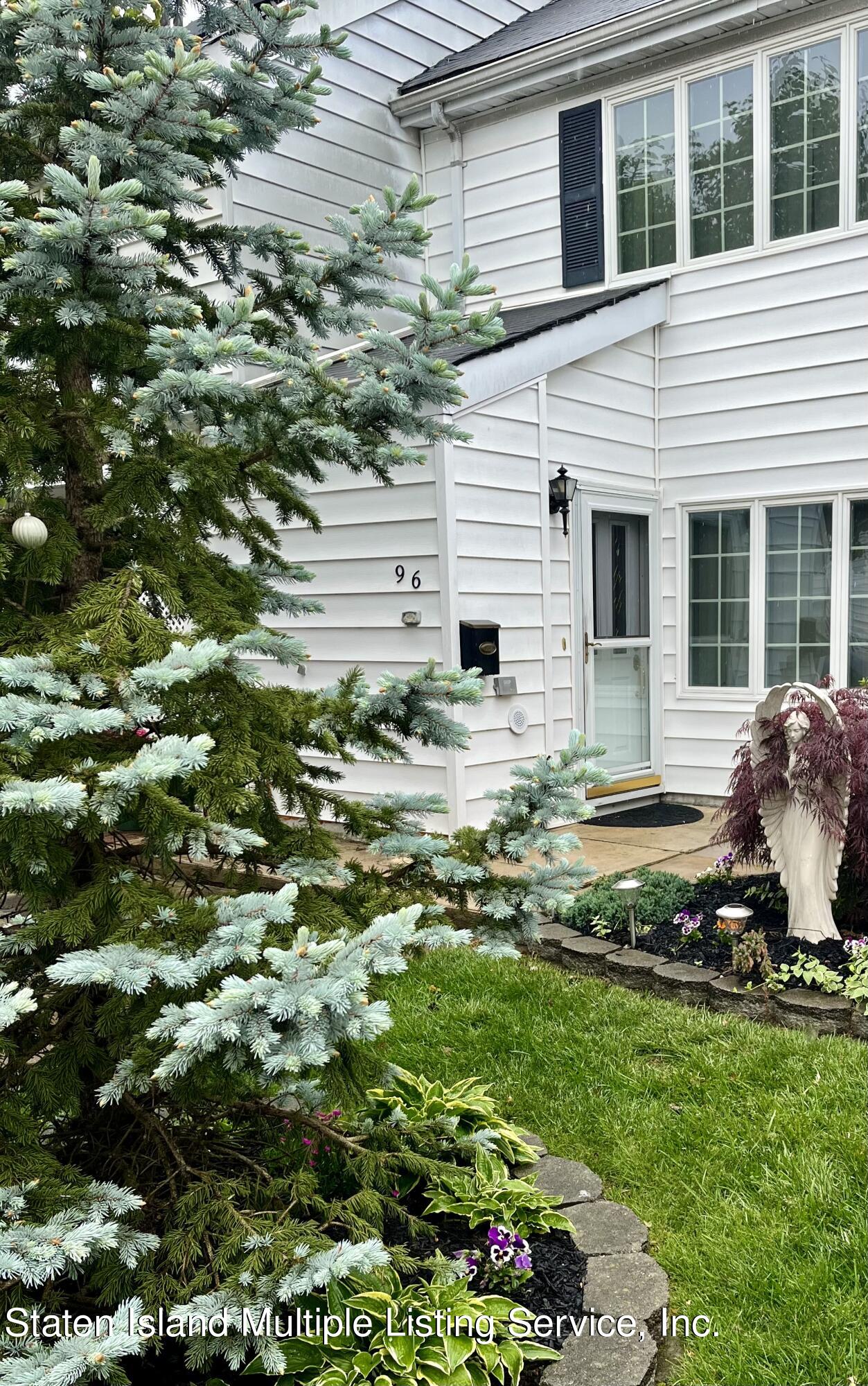96 Hampton Green Staten Island, NY 10312 - Photo 1 of 24 a house view with a garden space
