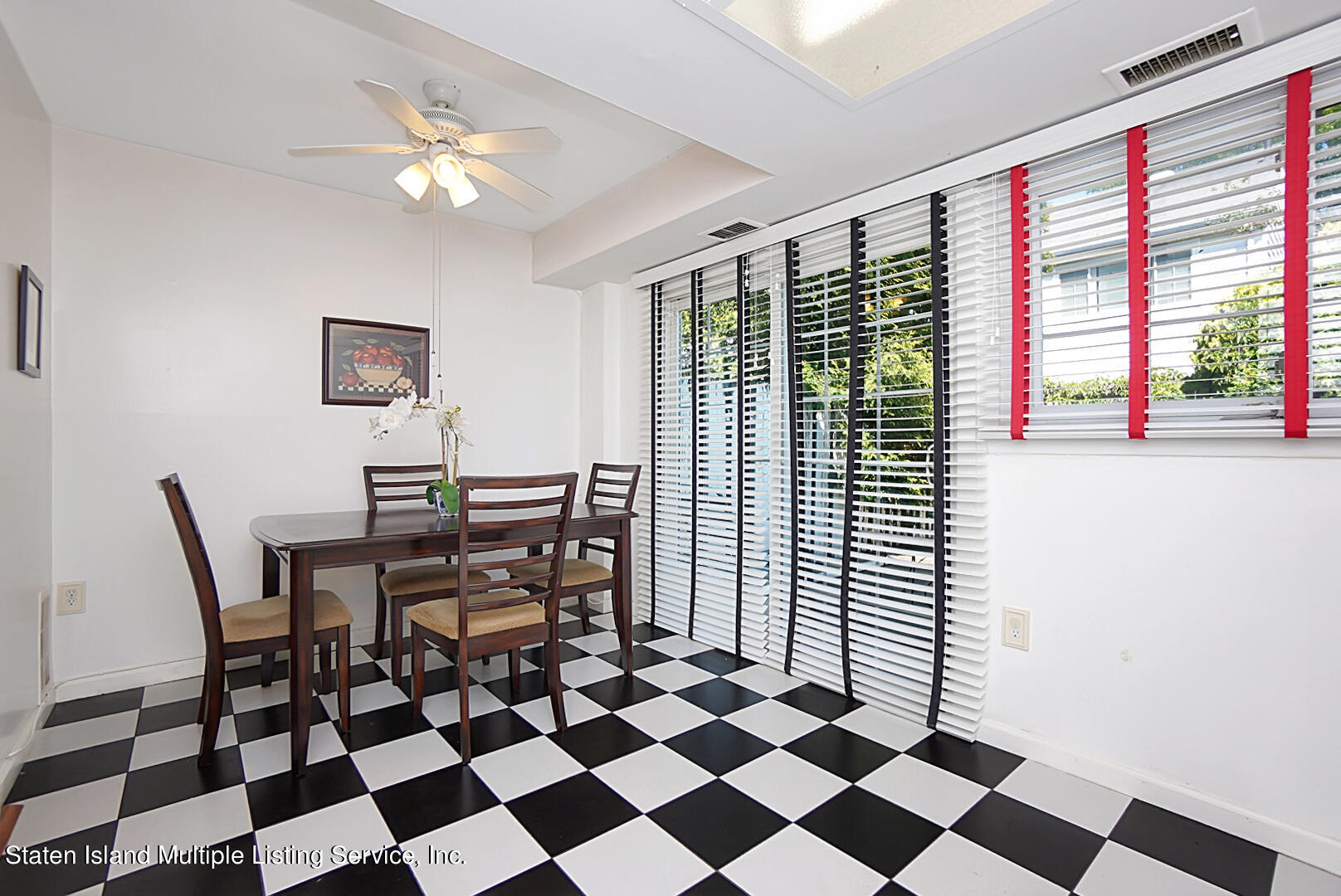 96 Hampton Green Staten Island, NY 10312 - Photo 11 of 24 a view of a dining room with a table and chair
