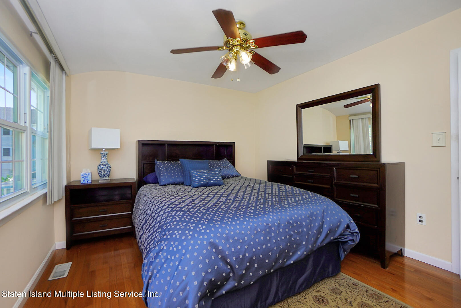 96 Hampton Green Staten Island, NY 10312 - Photo 14 of 24 a bedroom with a bed and a dresser