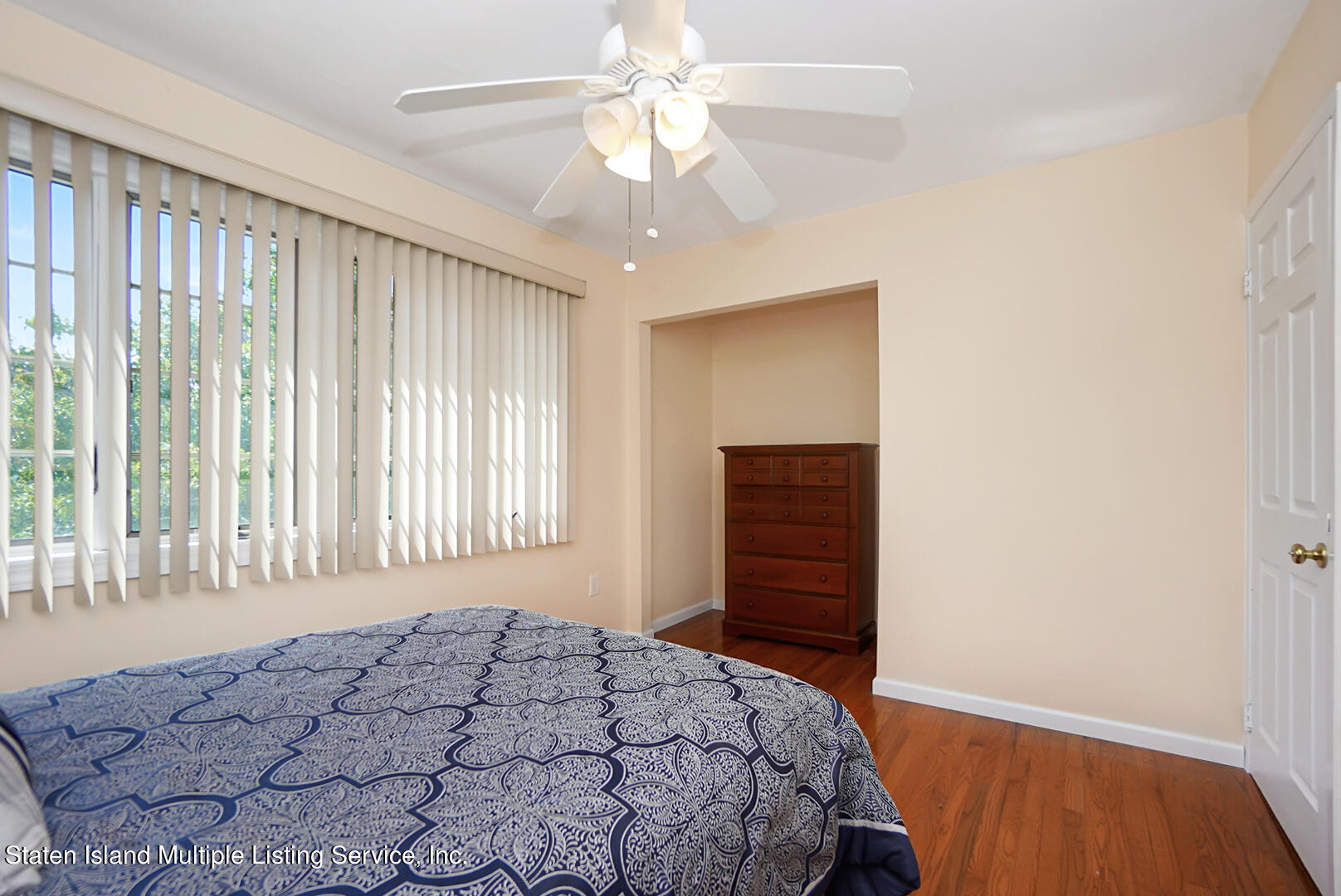 96 Hampton Green Staten Island, NY 10312 - Photo 19 of 24 a bedroom with a bed and a window