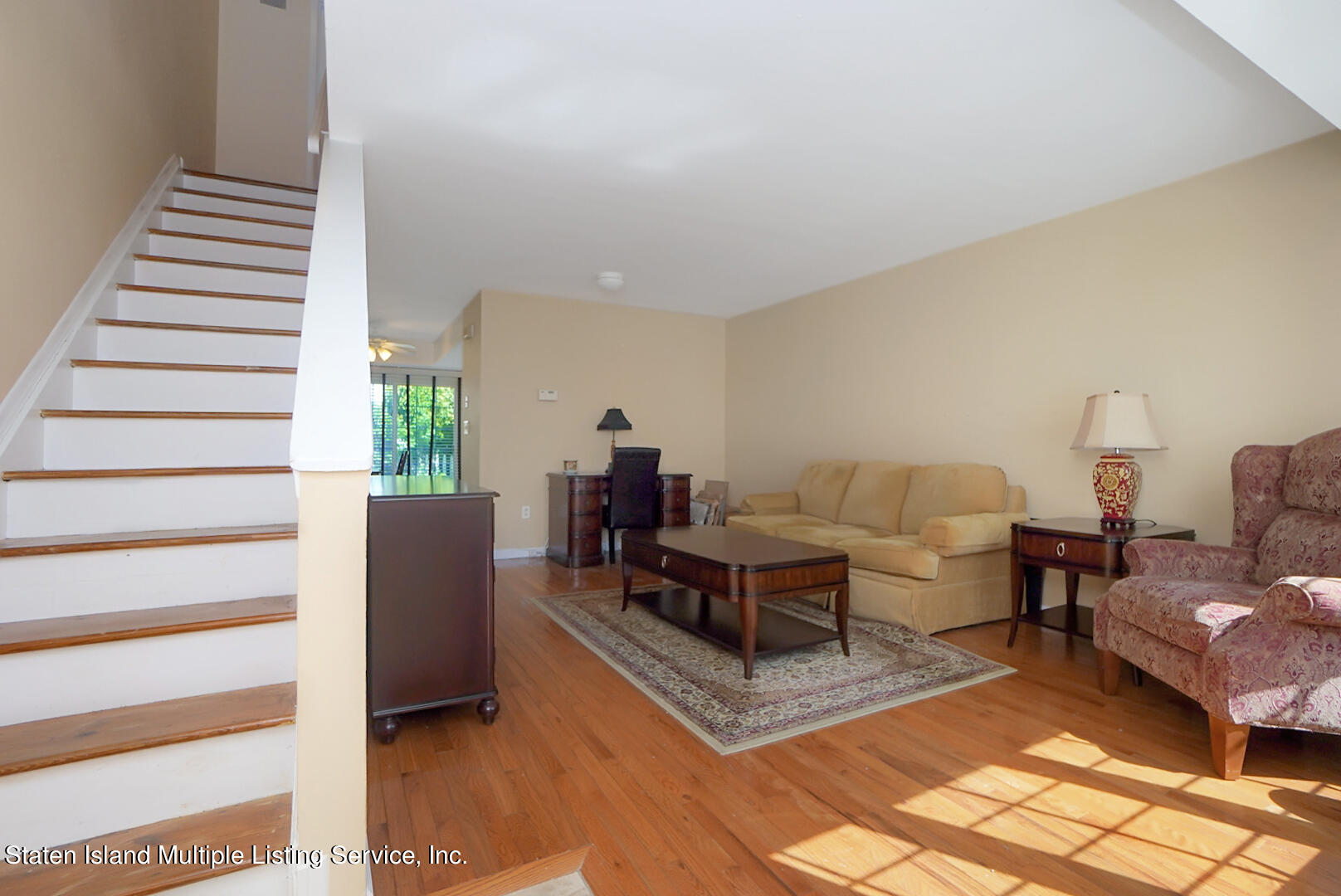 96 Hampton Green Staten Island, NY 10312 - Photo 5 of 24 a living room with furniture and wooden floor