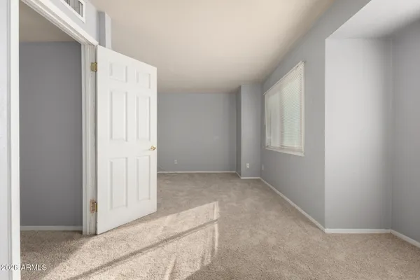 a view of an empty room with a window