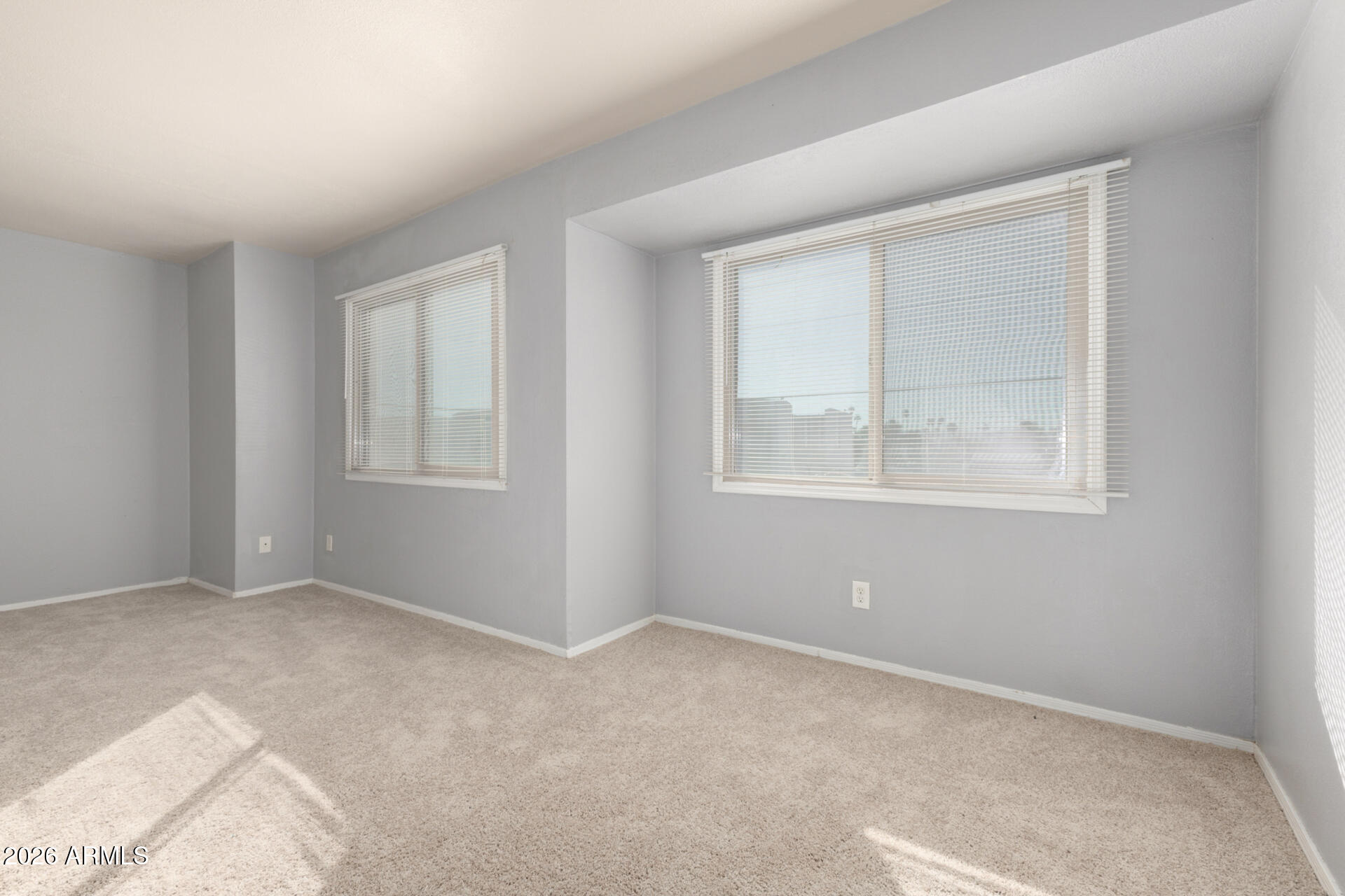 3936 West Camelback Road Phoenix, AZ 85019 - Photo 12 of 19 a view of an empty room with a window